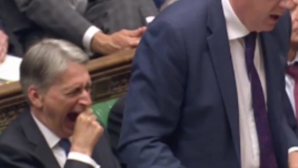 Philip Hammond yawning in Parliament during Prime Minister;s Questions